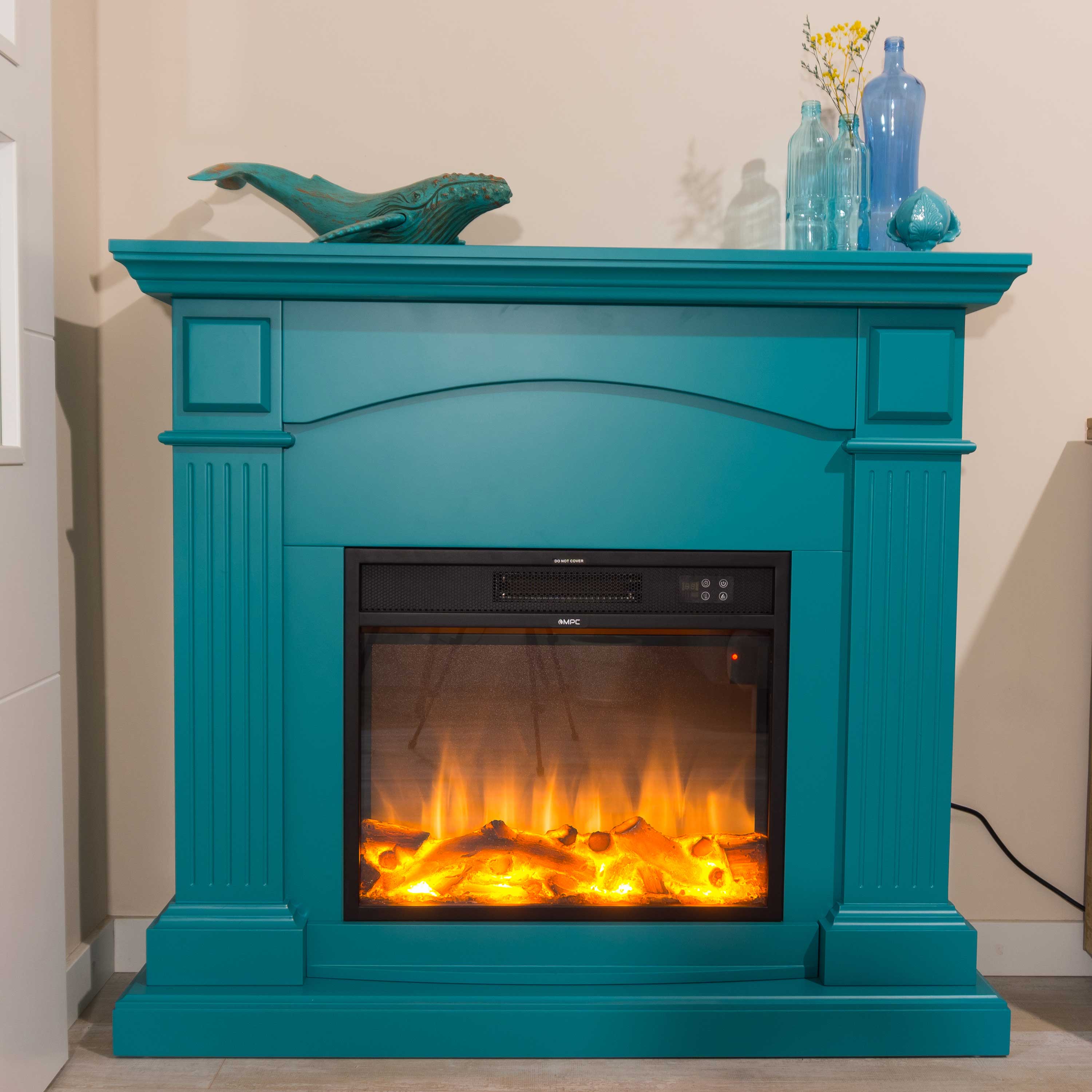 CAMINO-CETONA-TURCHESE-ambientata - SINED | Pool Showers | Garden Chaise Lounge | Electric Fireplaces | Infrared Heaters